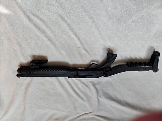 Self-loading shotgun with pistol grip folded 61 cm long