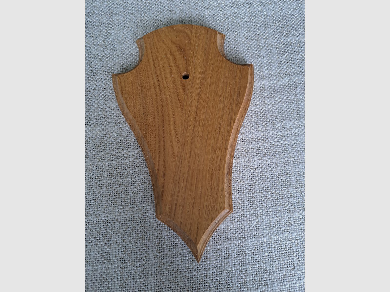 For sale: nearly new horn shield made of light oak.