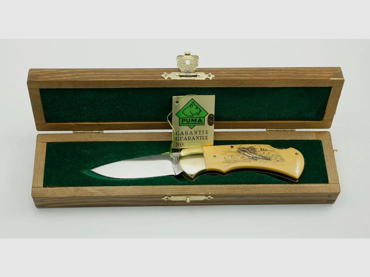(Rarities) Puma 4-Star 715 with brass inlays duck and pheasant, warranty card, 1983