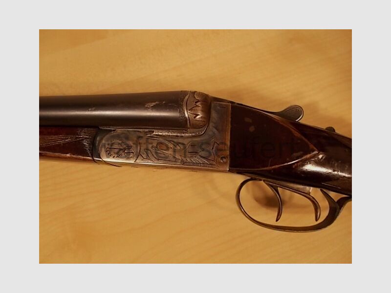Forest double-barreled shotgun colored and engraved