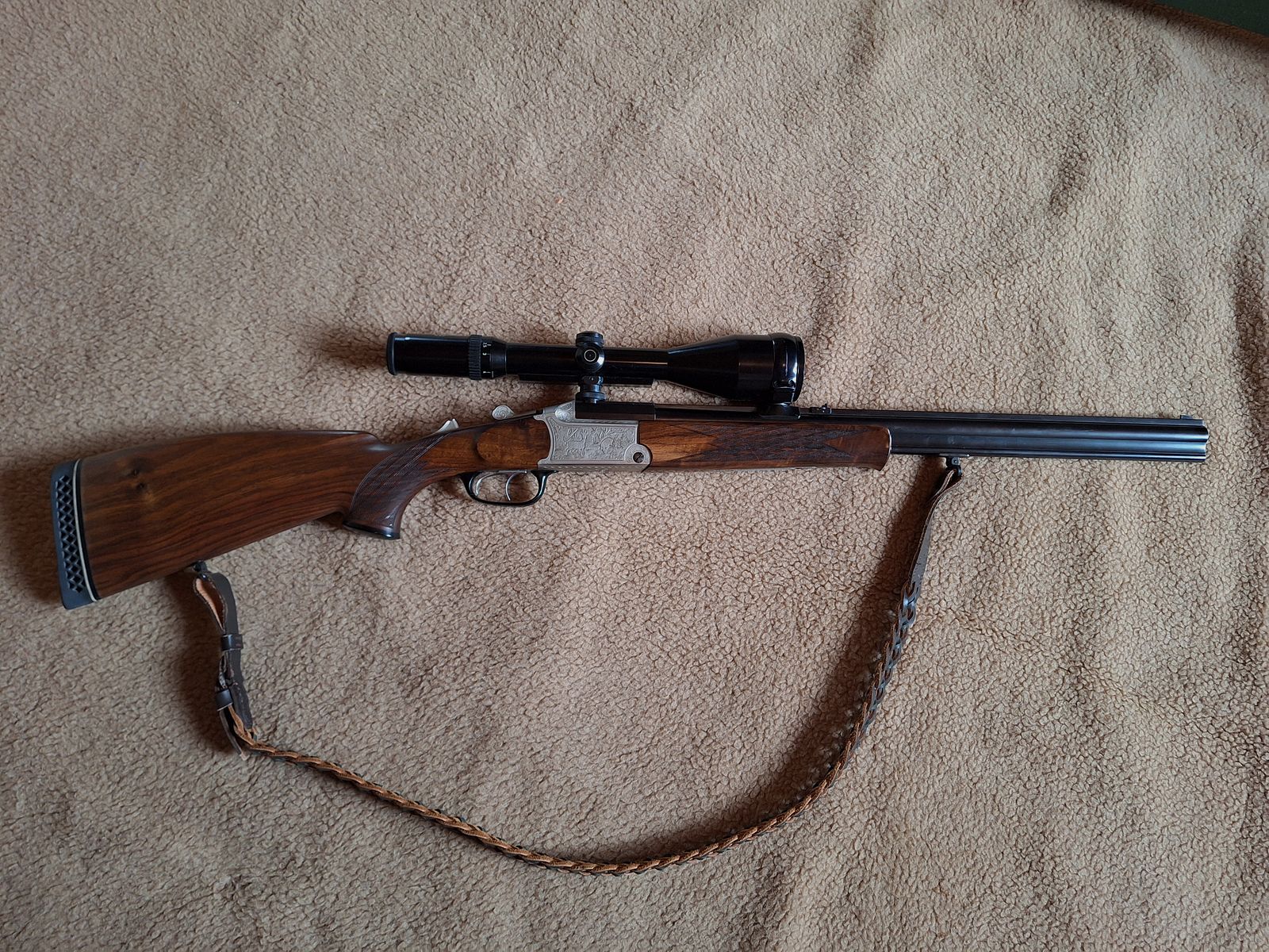 Escopeta combinada de Blaser, modelo BBF 700/88, calibre 12/70 cañón de escopeta, .30-06 cañón de rifle, visor Schmidt & Bender 2,5 - 10x