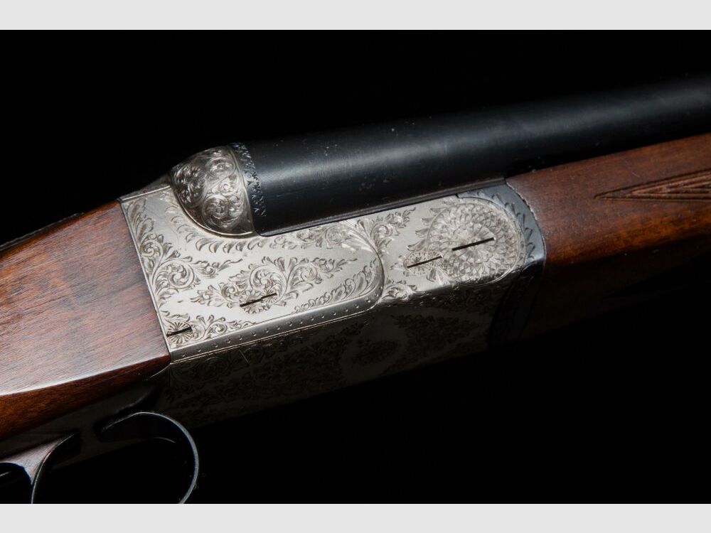 elegante Doppelflinte mit umfassender Gravur