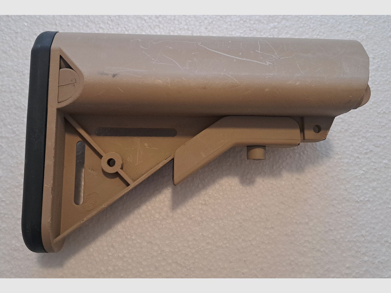 AR-15 / M4 Carbine folding stock with storage compartment sand
