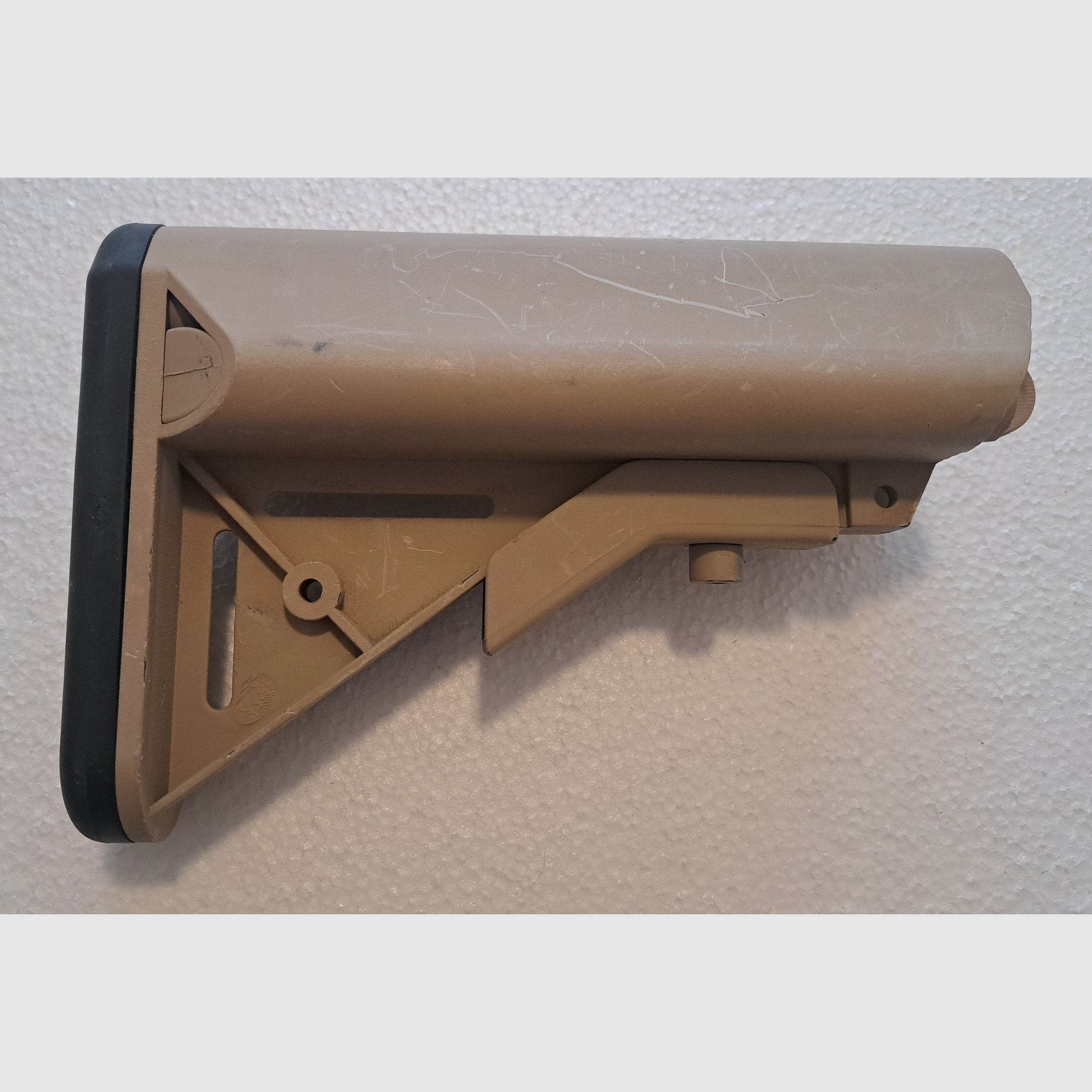 AR-15 / M4 Carbine folding stock with storage compartment sand