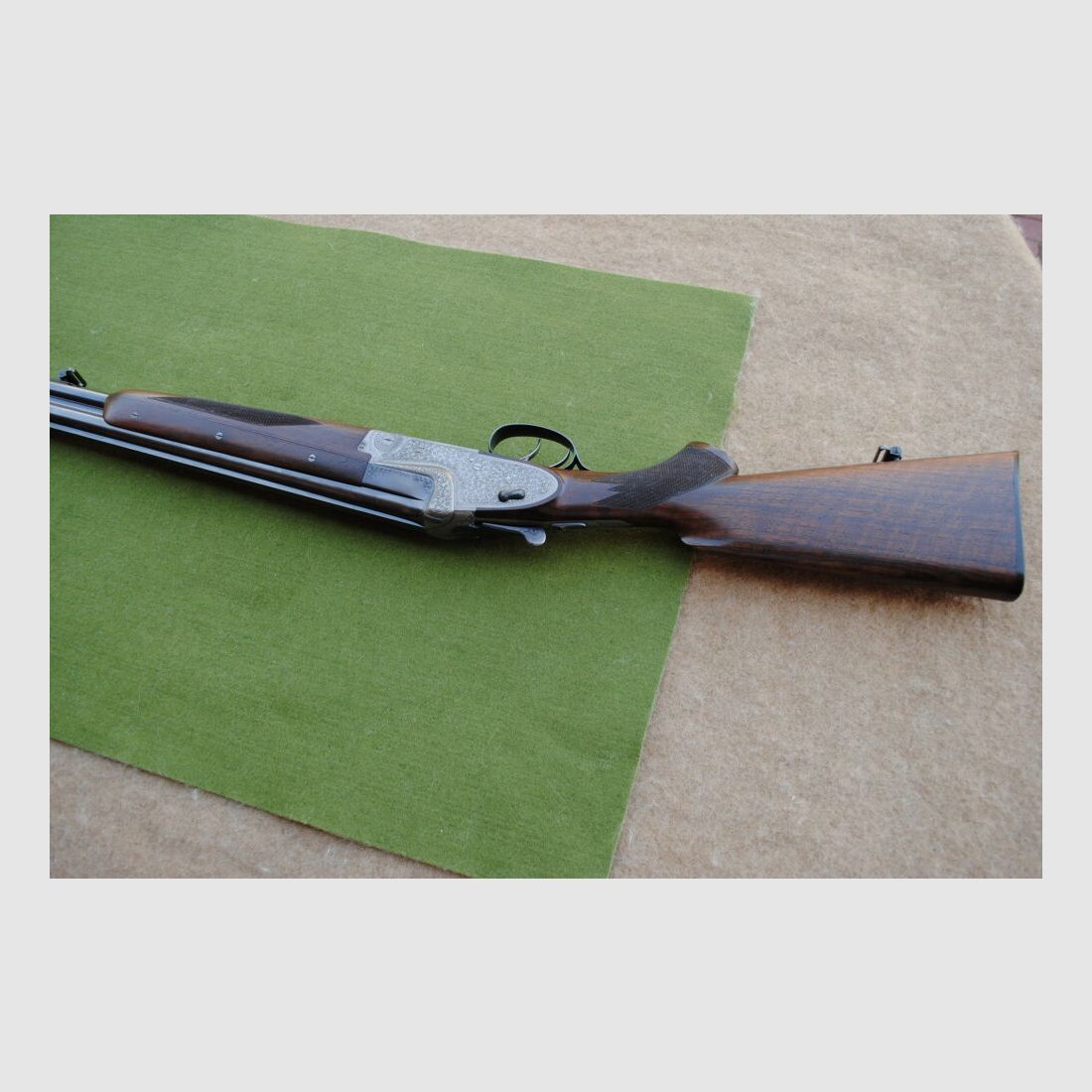 hand-engraved Merkel side lock double barrel shotgun, model 203E