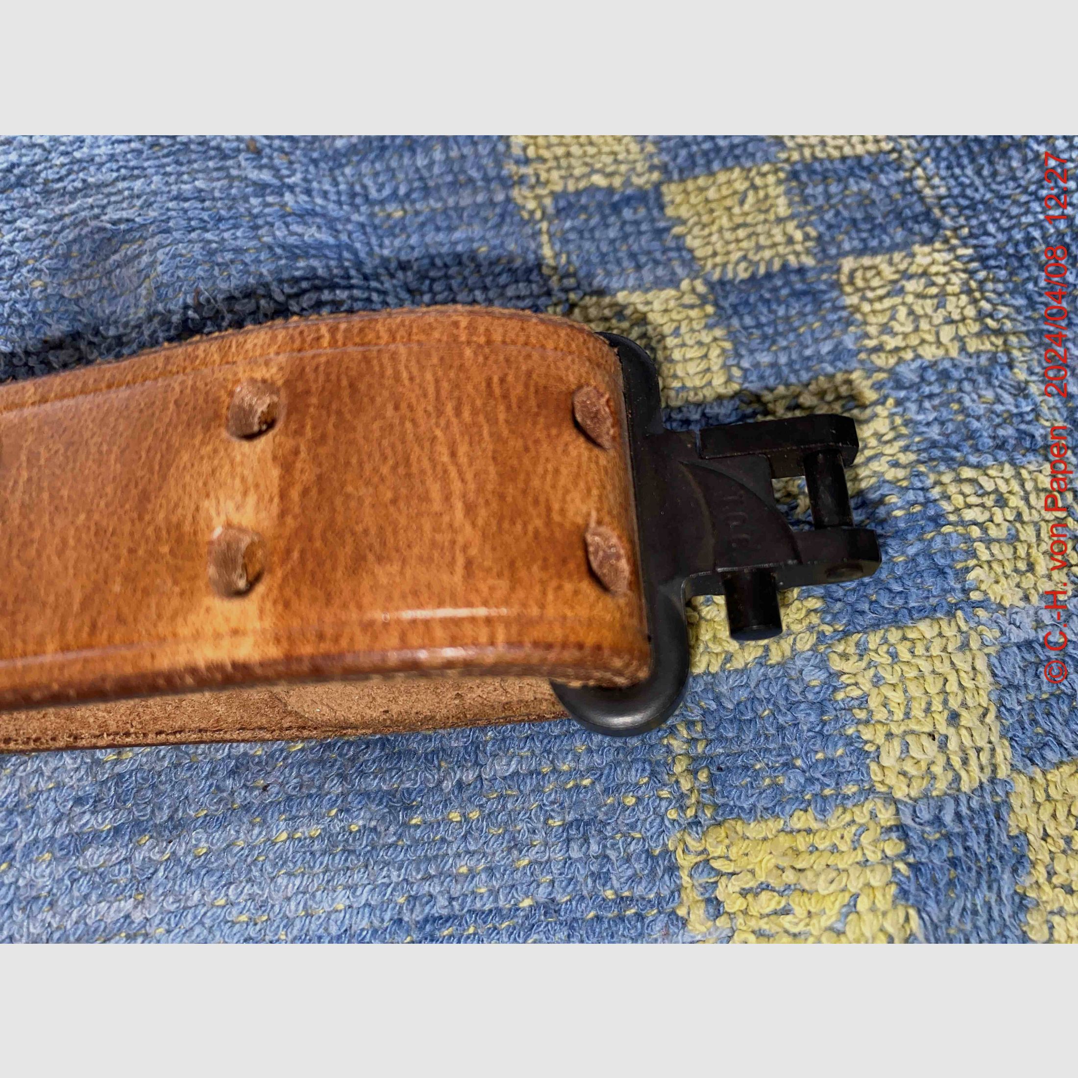 Rifle sling with strap buckle