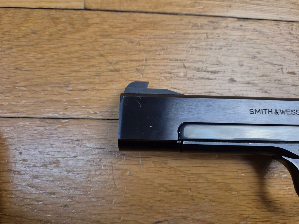 Superbe pistolet Smith & Wesson Mod.41 – cal.22LR – Tout en vrai acier – Bronzage à 100% – Arme de 1980 – Mécanique et canon hors pair – Une des armes les plus basses sur la main jamais fabriquée – Superbe État – TBE++, billede 9 af 22