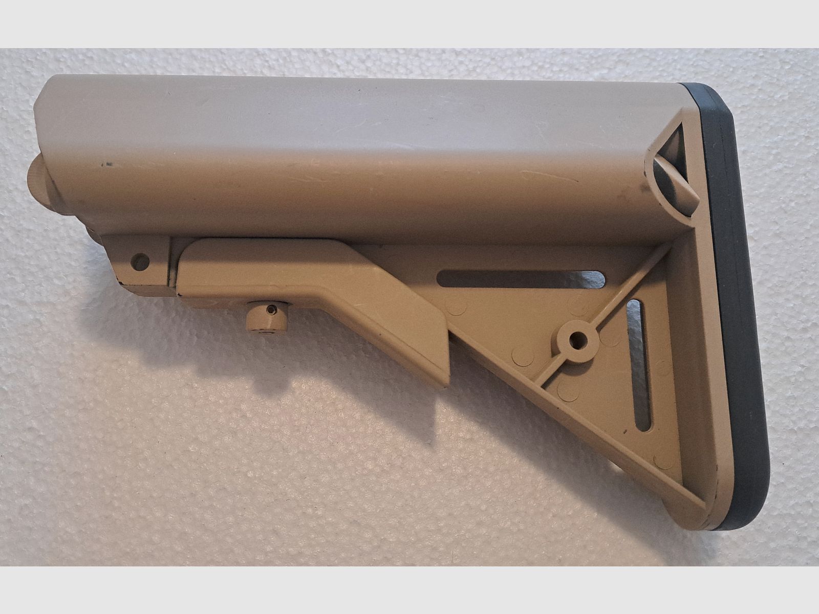AR-15 / M4 Carbine folding stock with storage compartment sand