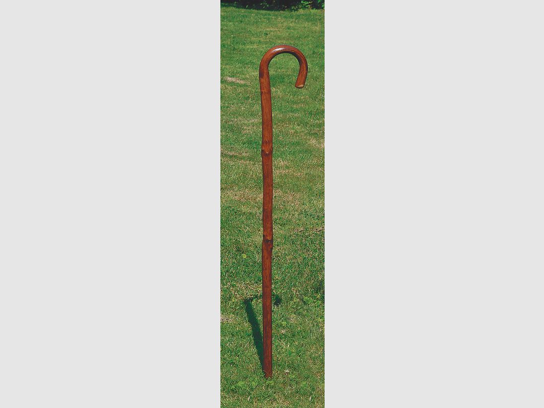 Walking stick made of flamed solid wood
