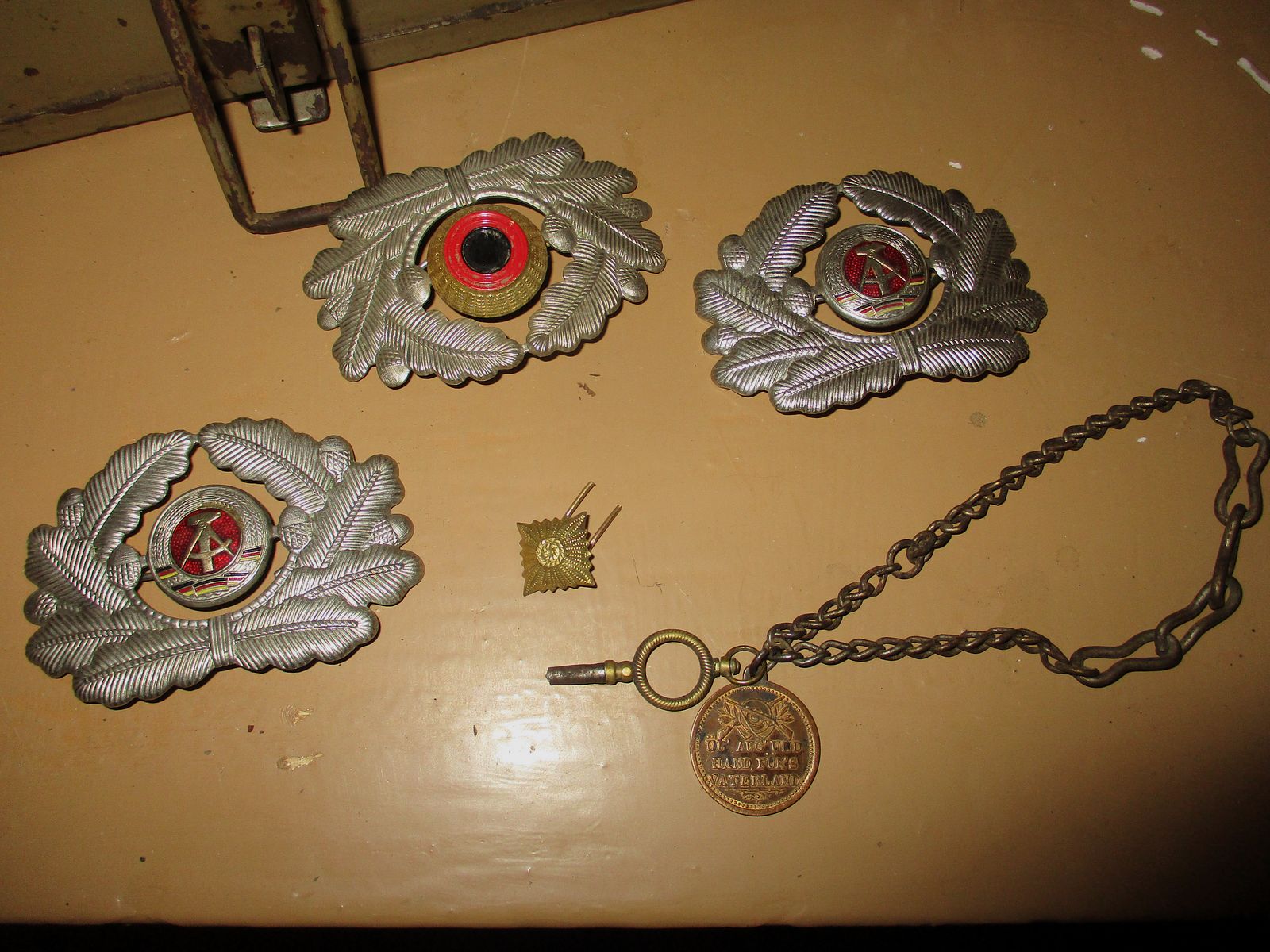 Swiss army knife, among other things, old metal ammunition box, medal on chain, among other things, military