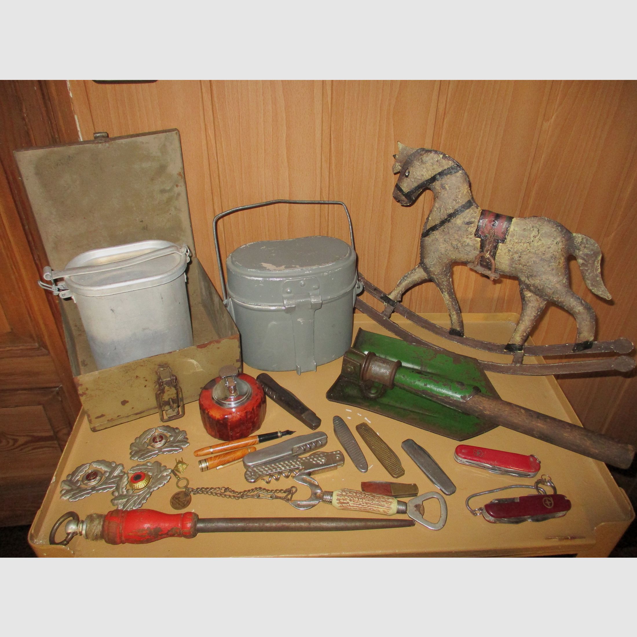 Swiss army knife, among other things, old metal ammunition box, medal on chain, among other things, military