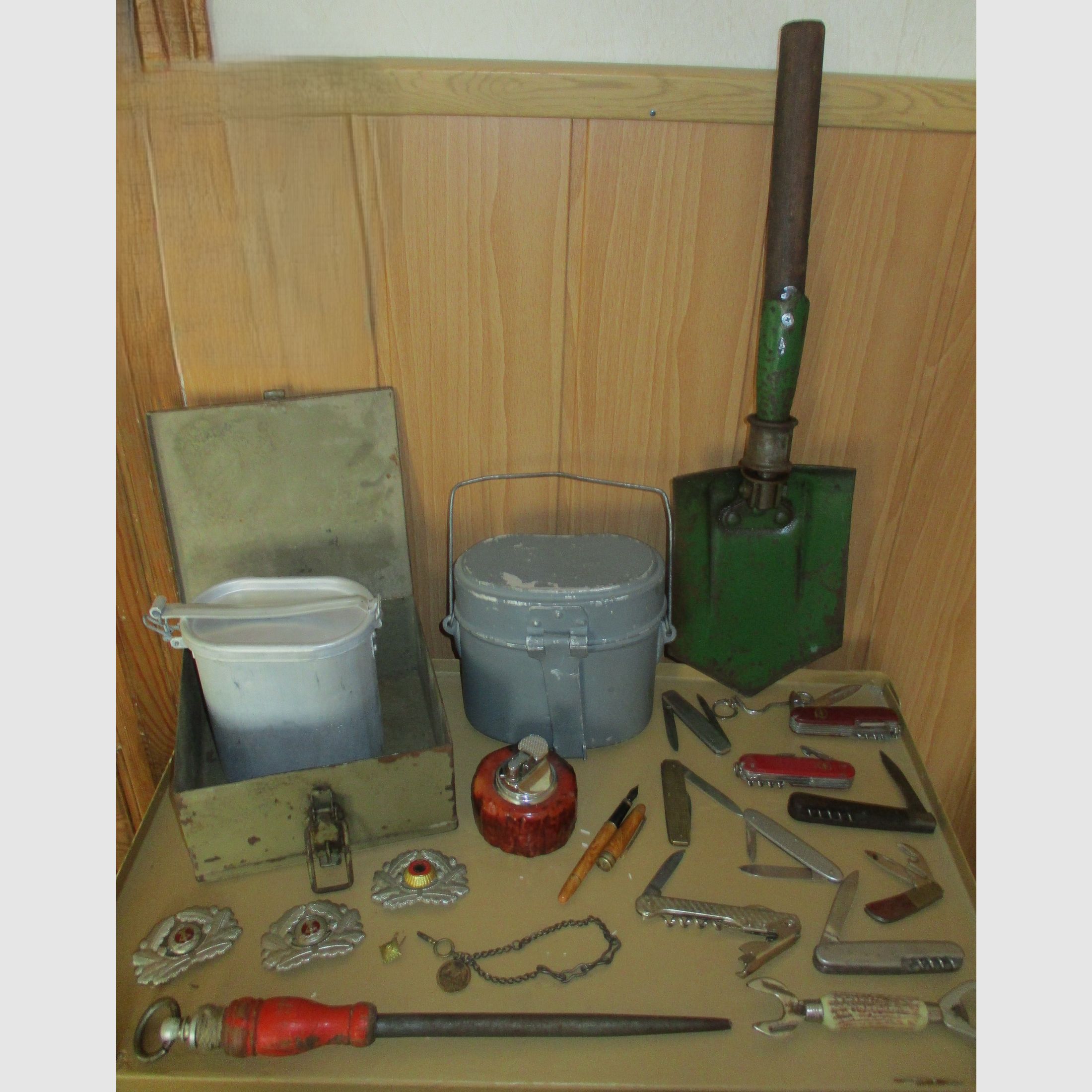 Swiss army knife, among other things, old metal ammunition box, medal on chain, among other things, military