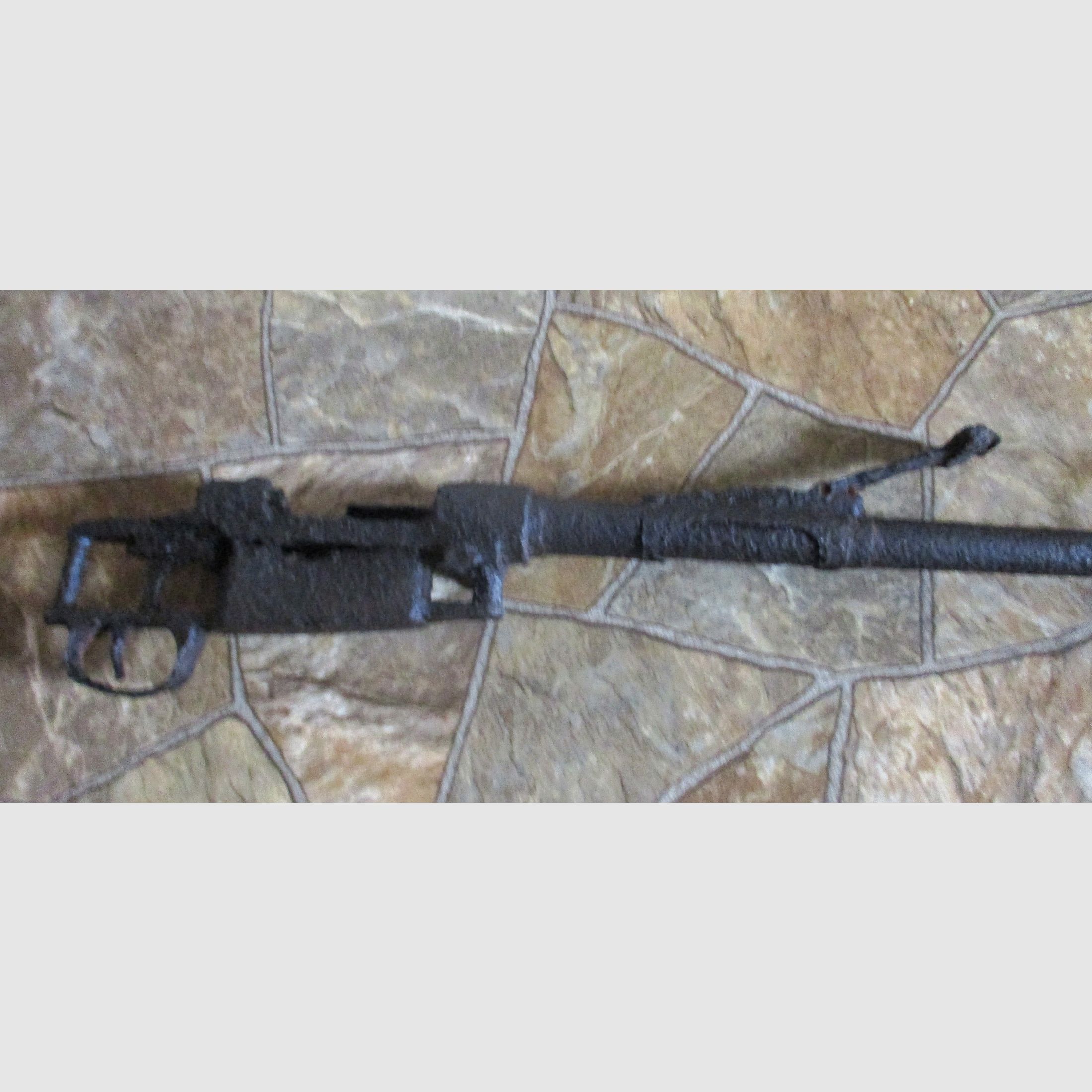 old rifle from World War I or II, decorative barn find