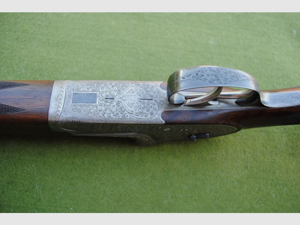 hand-engraved Merkel side lock double barrel shotgun, model 203E