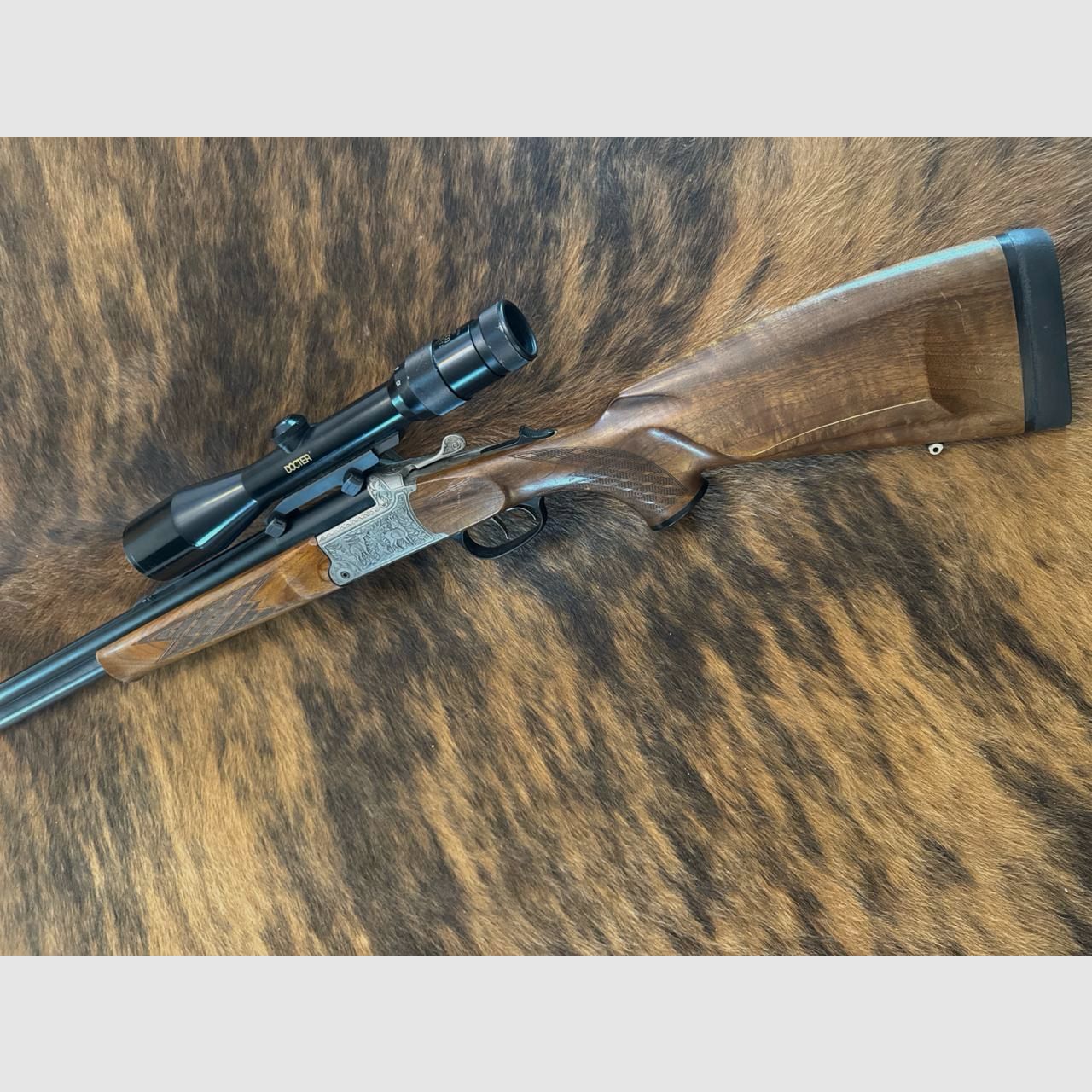 Blaser Bockbüchsflinte BBF 95, 5,6x50R Magnum + 16/70 con telescopio Docter 2,5-10x48 M