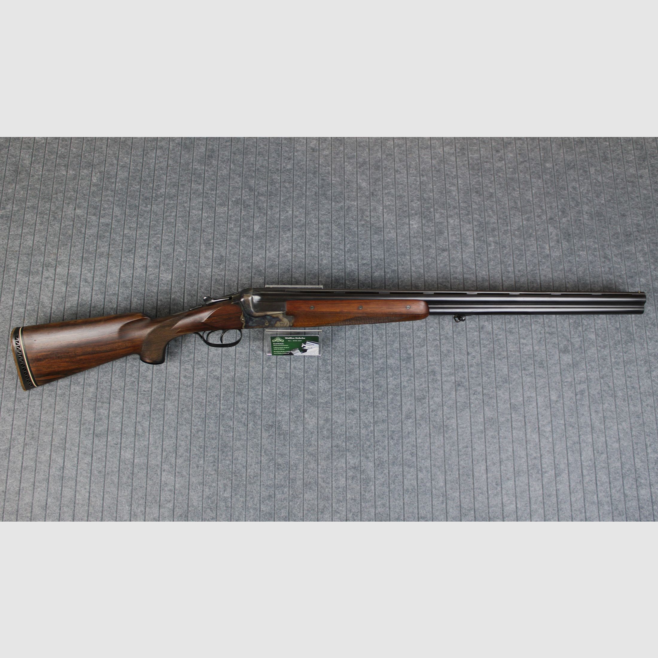 Merkel over-and-under shotgun 12/70