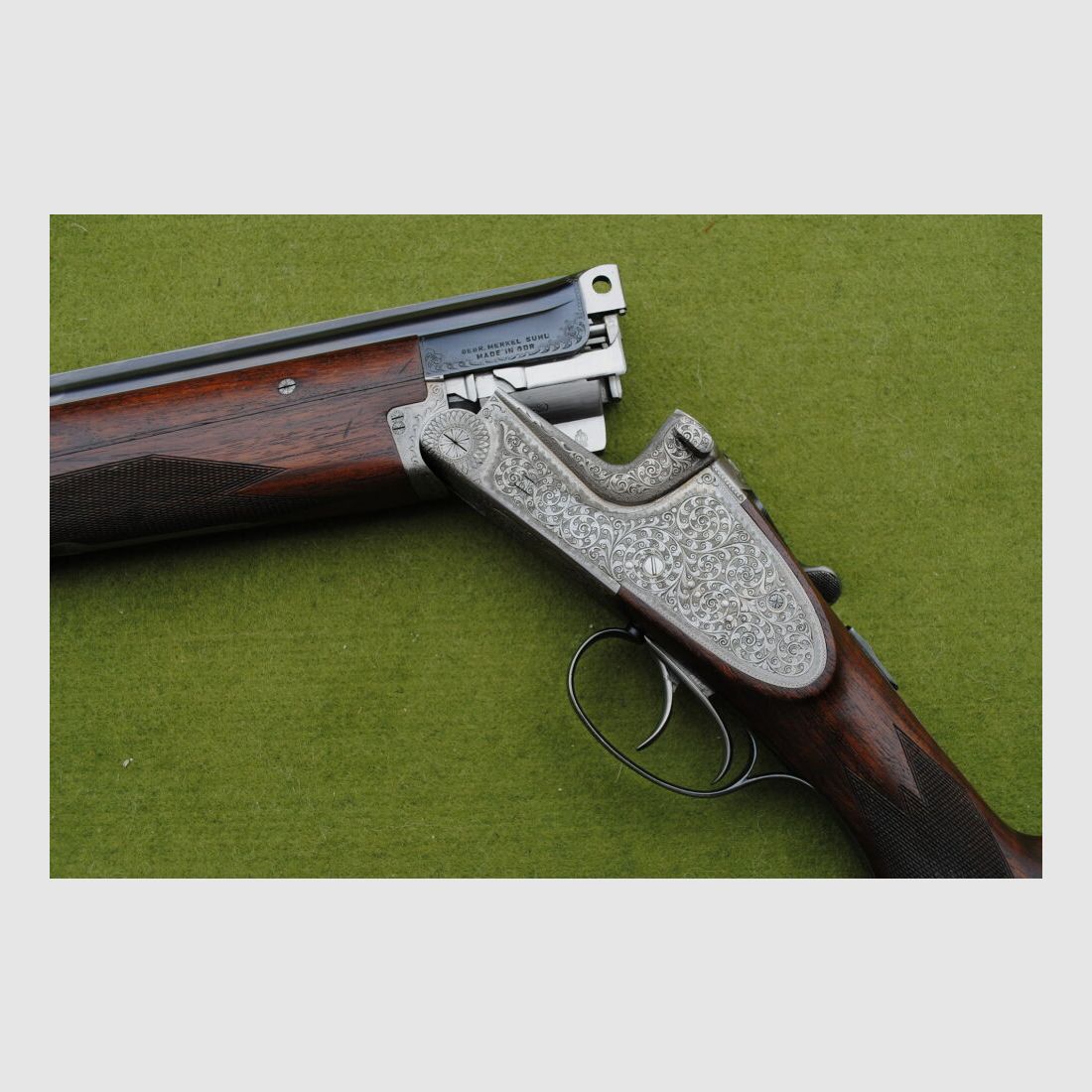hand-engraved Merkel side lock double barrel shotgun, model 203E