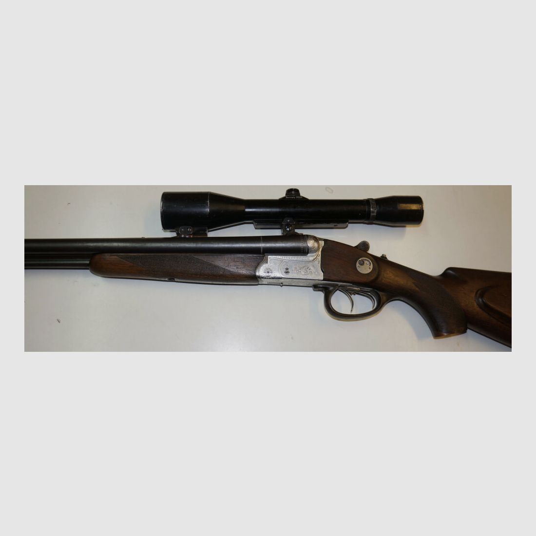 Krieghoff Drilling, Krieghoff, Kal.7x57R / Kal.16/70, mit GECO Zielfernrohr und schönen Gravuren