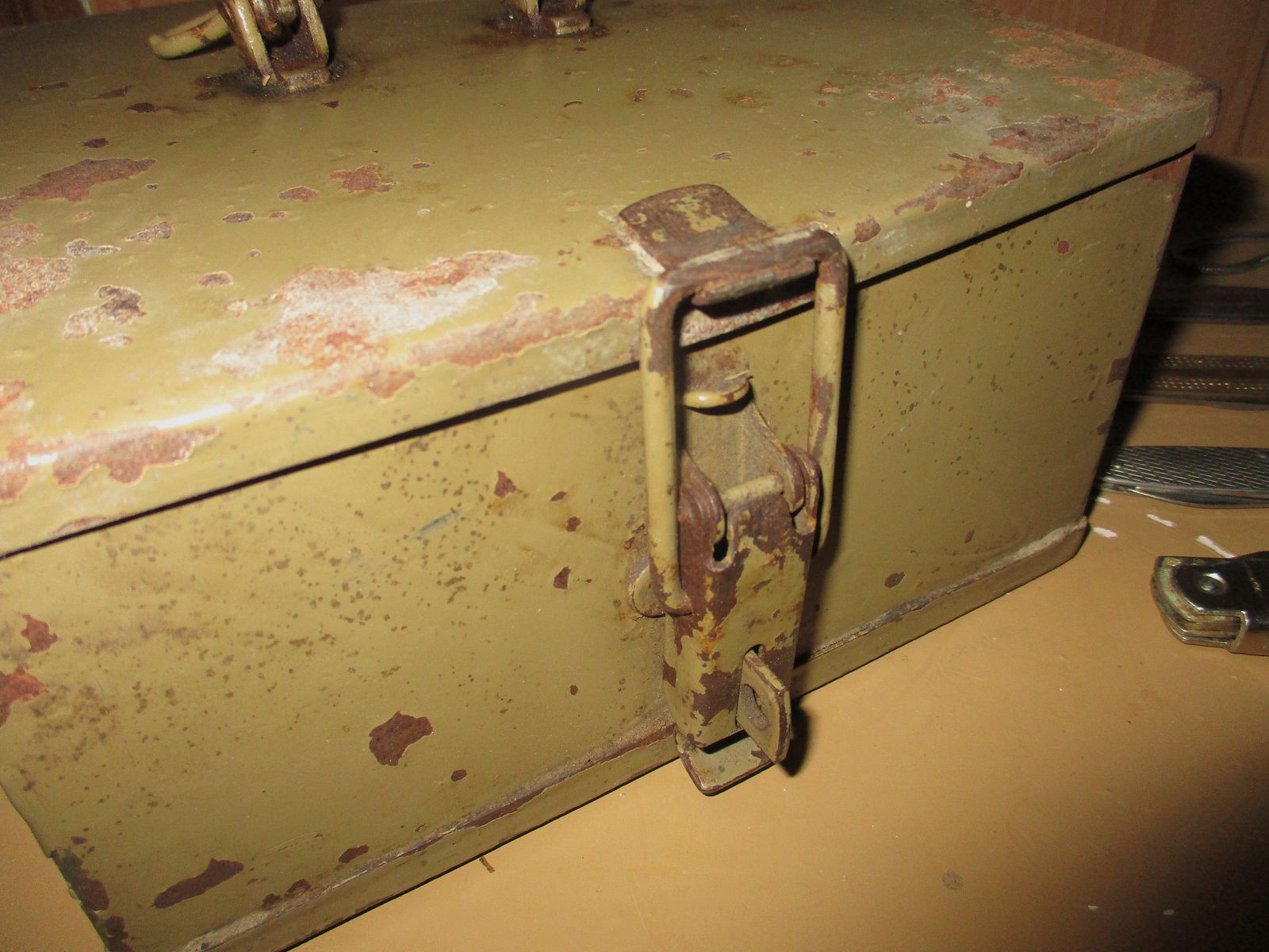 Swiss army knife, among other things, old metal ammunition box, medal on chain, among other things, military