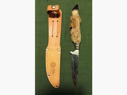 Traditional hunting knife with deer foot handle