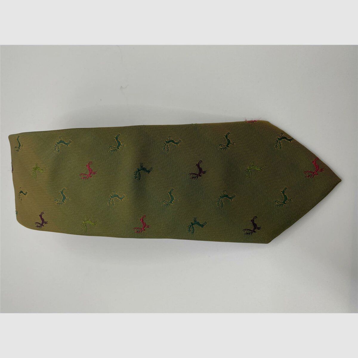 Tie dark green with a bit of orange motif dark green, light green, pink, and purple deer