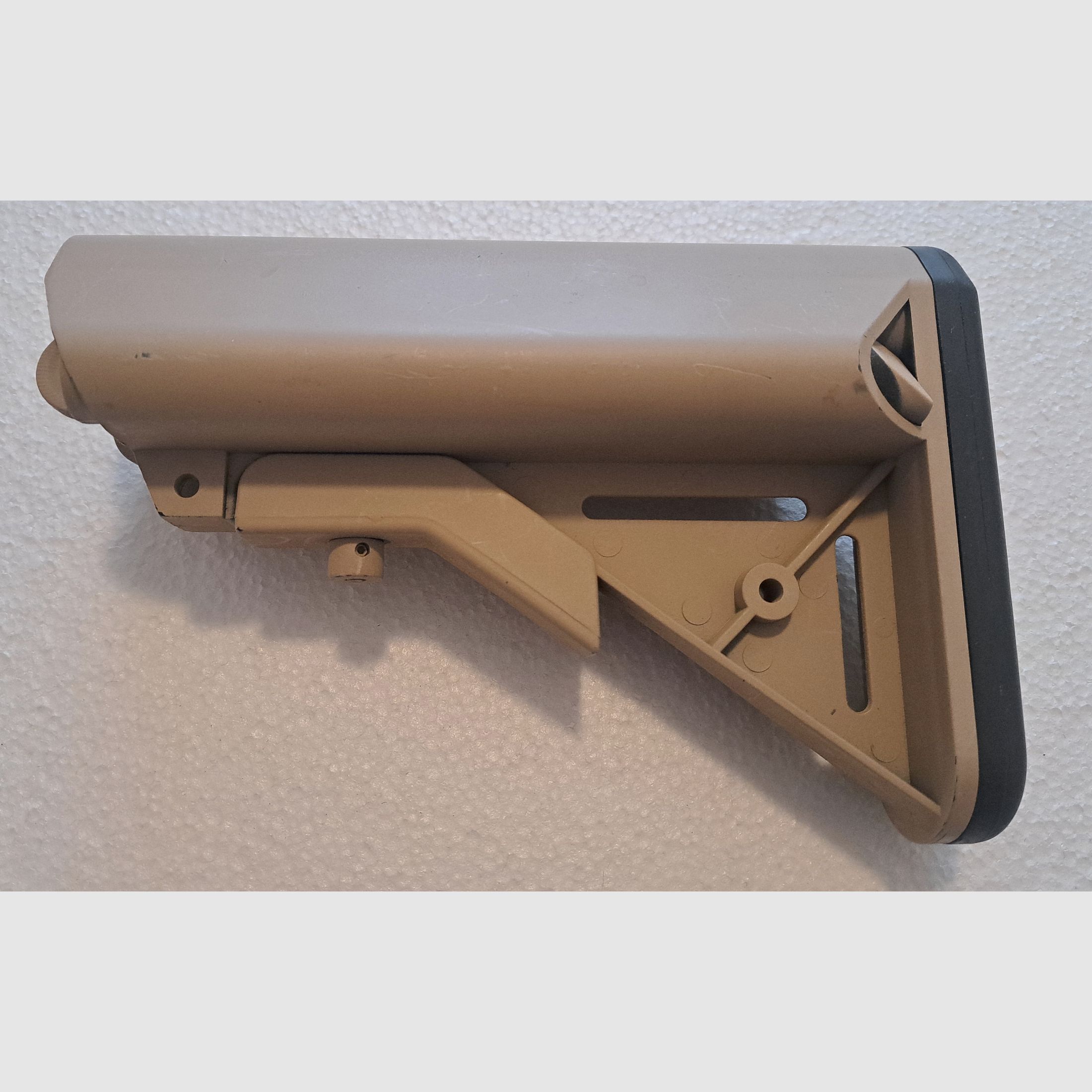 AR-15 / M4 Carbine folding stock with storage compartment sand