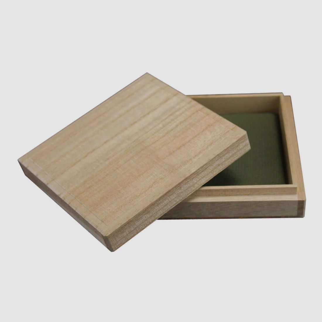 Tsubabox made of solid wood with green upholstery