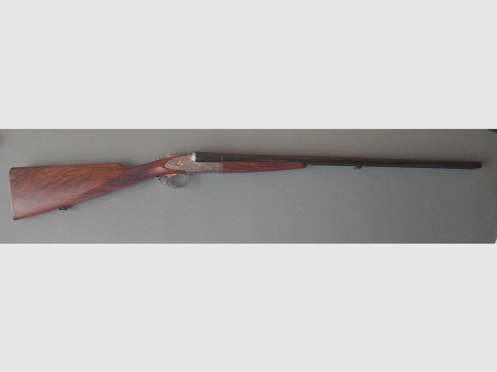 A 153 SIDE-BY-SIDE FAUSTI STEFANO MOD STILE EL GOLD .20 CAL 71 CM BARRELS SINGLE TRIGGER WITH AUTOMATIC EXTRACTORS, image 1 of 9