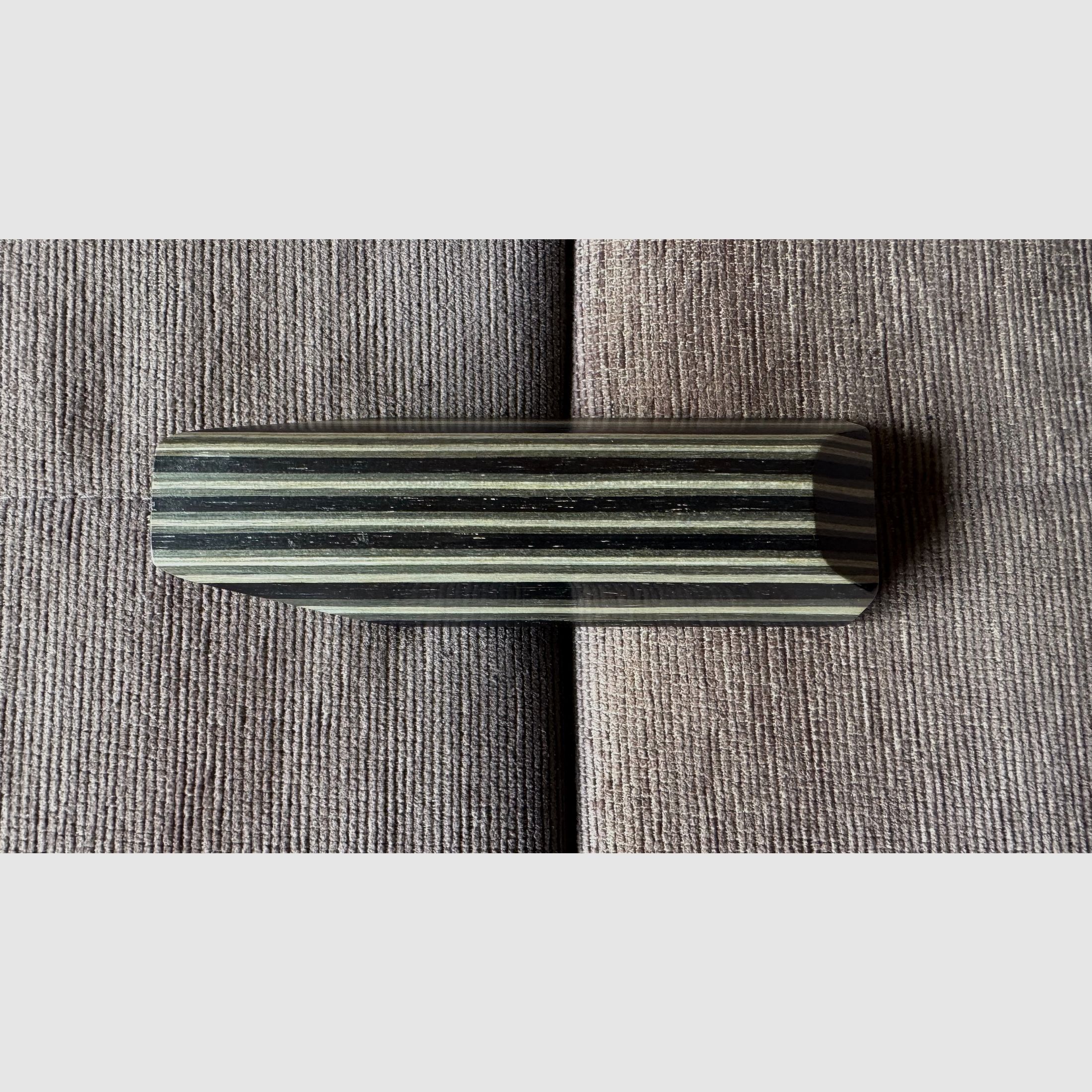 Feinwerkbau 700 cheek piece made of laminated wood.