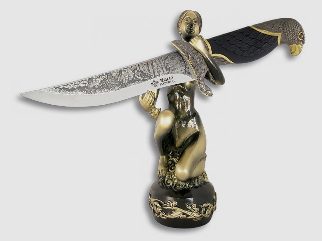 Knife with decorated handle, eagle handle and "naked woman" stand