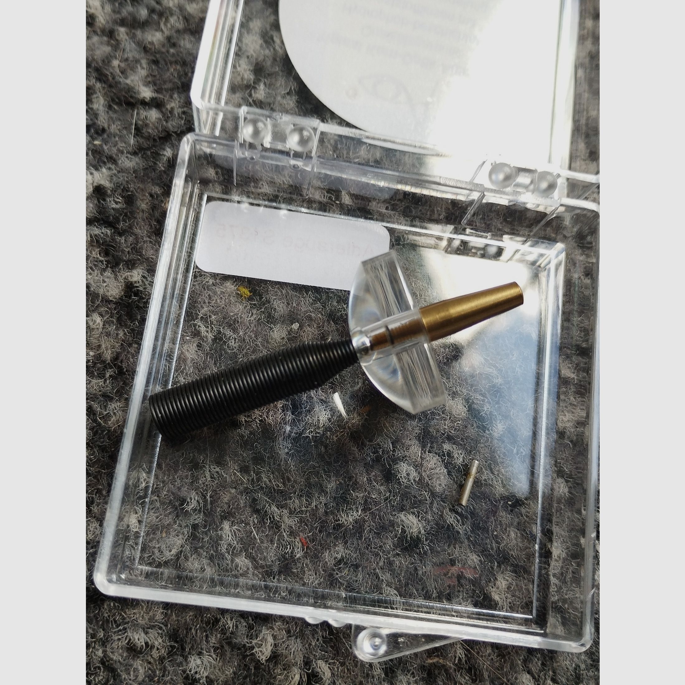 Unused bullet hole tester with magnifying glass