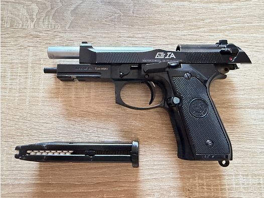 Pistola de airsoft KJW Beretta M9A1 con un cargador de gas