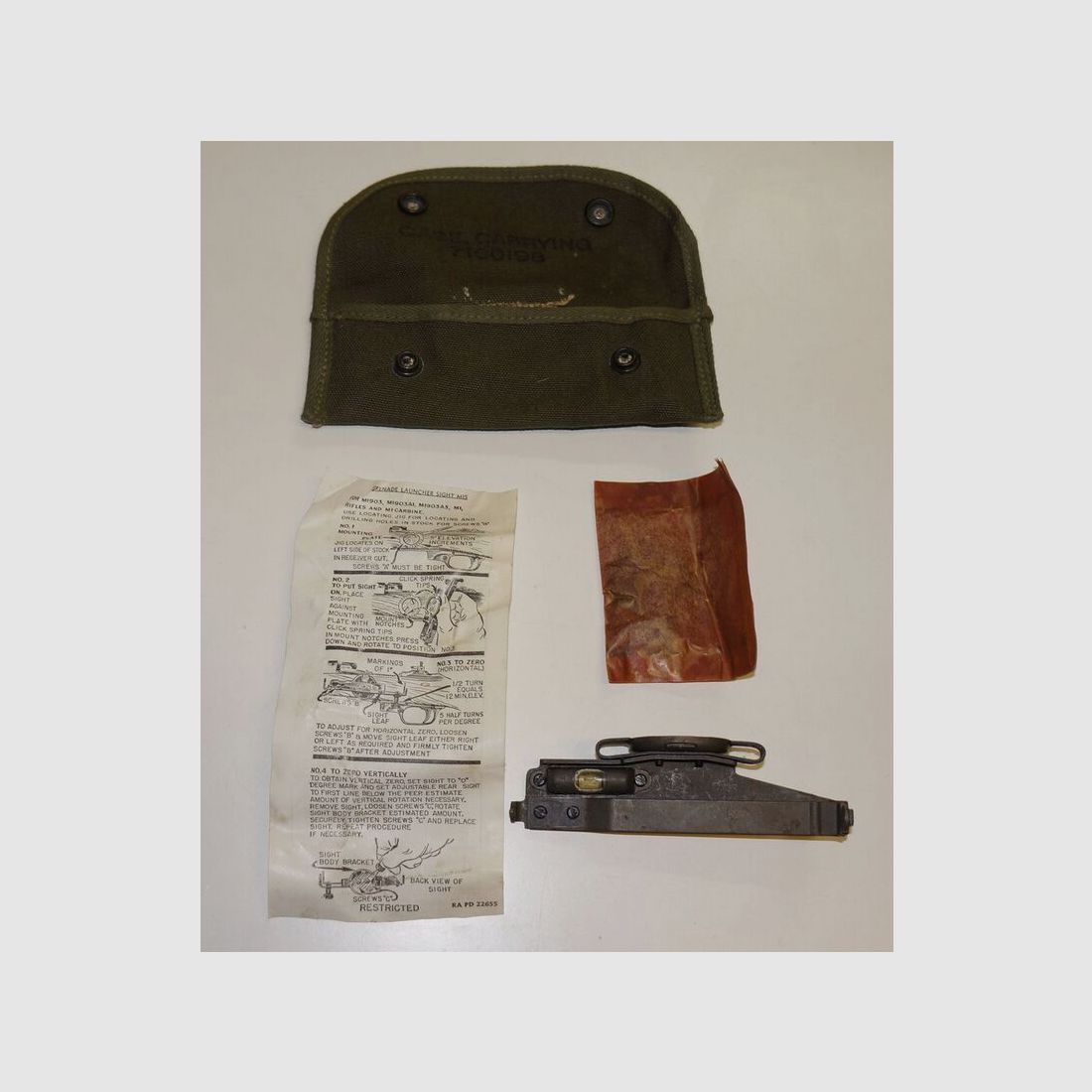 M1 Garand grenade sight with instructions, mounting materials, and bag
