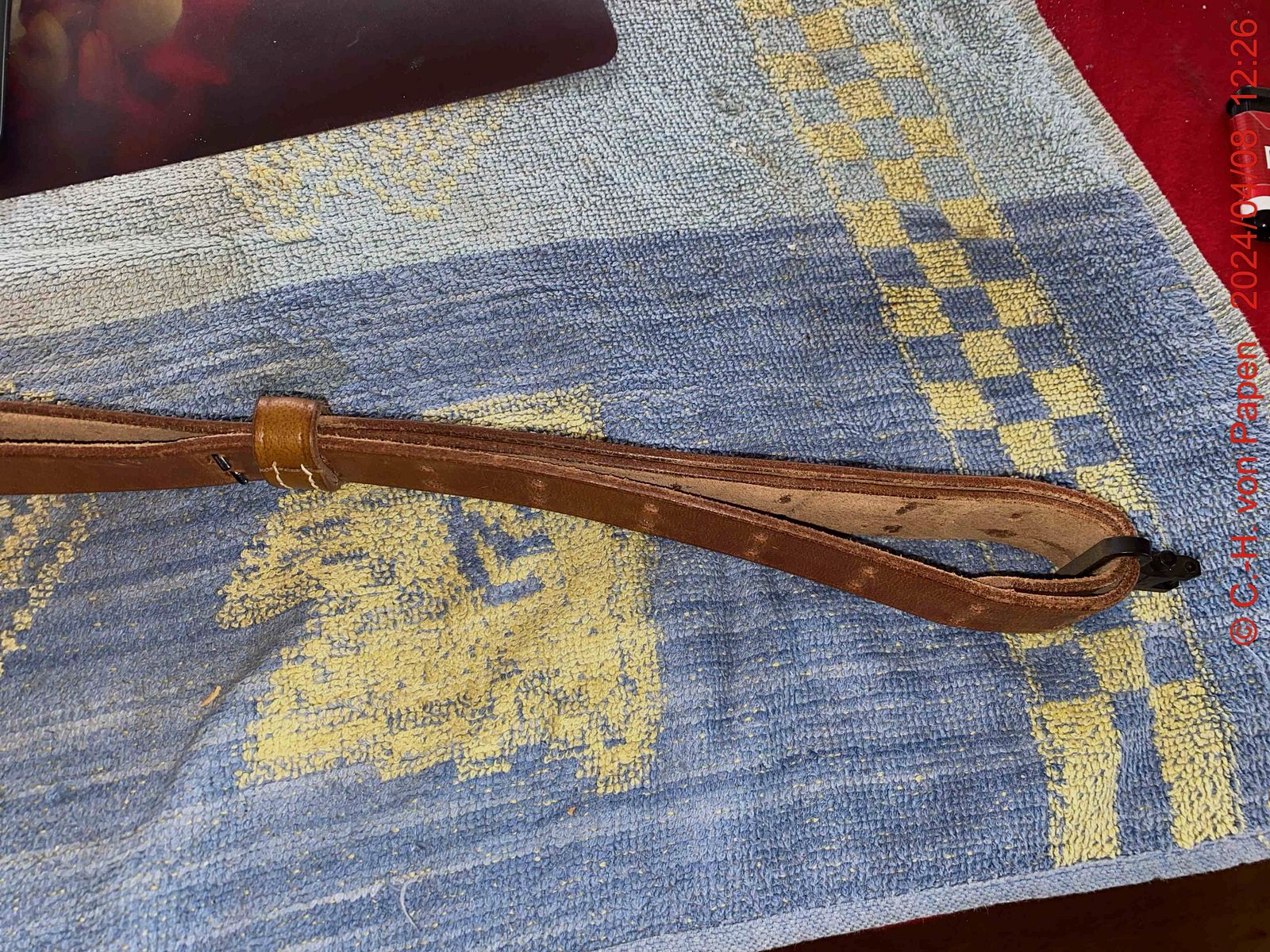 Rifle sling with strap buckle