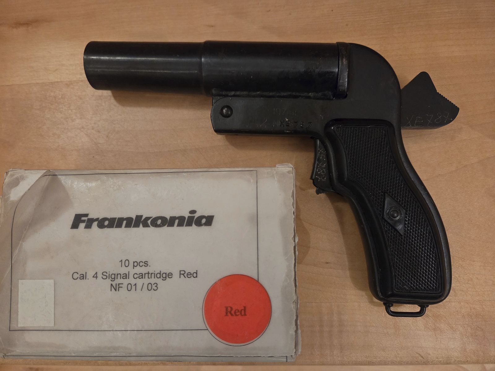 Flare gun with red signal ammunition