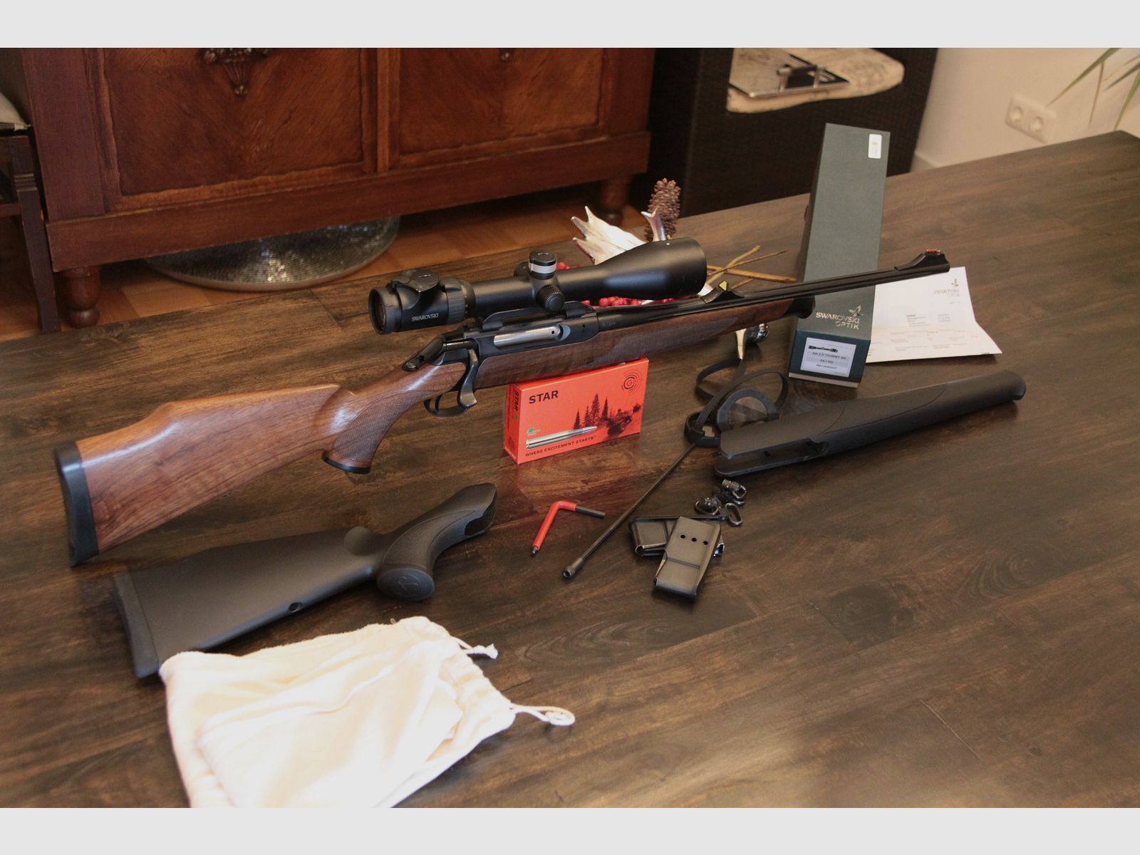 Sauer 202 with two stock sets in 8x57iS including Swarovski z6i 2.5-15x56