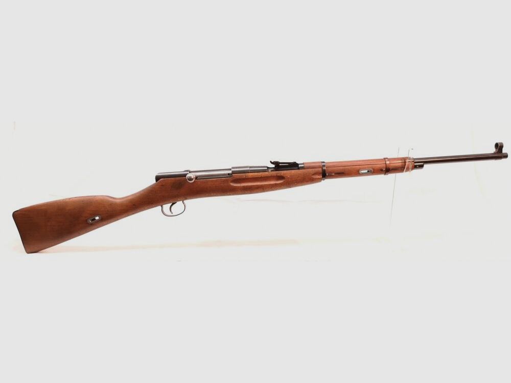 Karabin treningowy Mosin Nagant - karabin treningowy, z numerami zgodnymi, przedni metalowy uchwyt w kolorze brązowym.