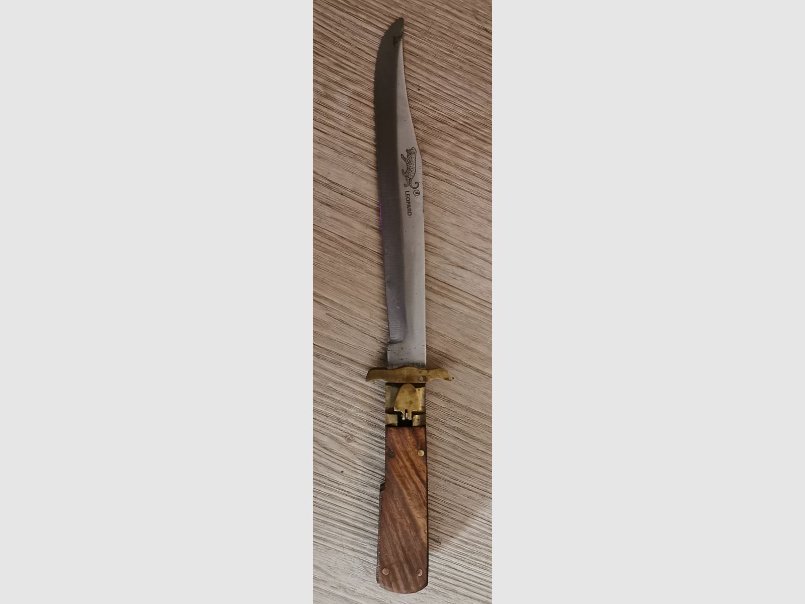 Coltello a serramanico leopardato antico