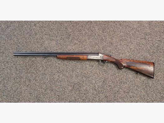 Savage 24 over-and-under rifle shotgun caliber .22 winMag/.410/76