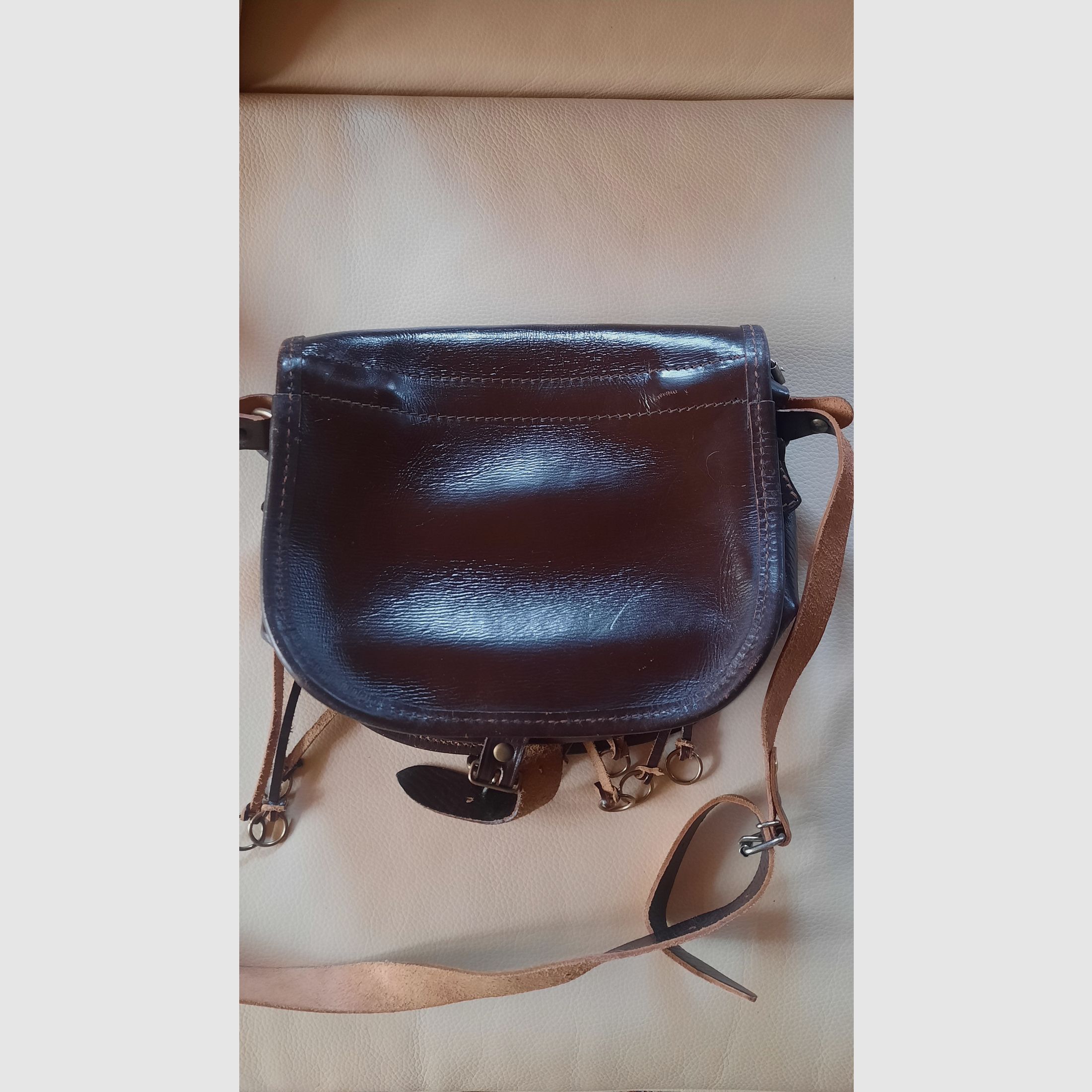 Lederset mit 2 Fernrohrköchern, einer Jagdtasche und einem Patronengurt