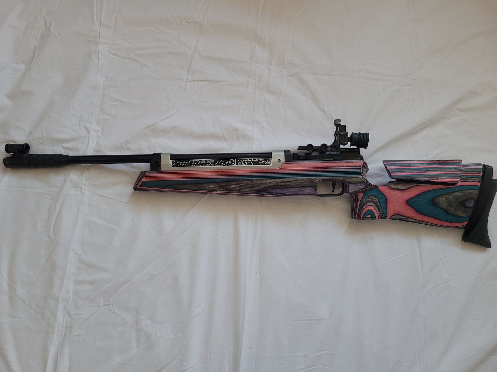 ANSCHÜTZ SUPERAIR 2002, KOLOROWY STOCK WARSTWOWY, 4,5 MM DIABOLO, Z POKROWCEM NA KARABIN, zdjęcie 1 z 6