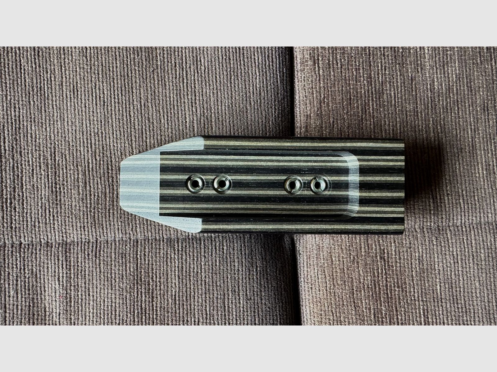 Feinwerkbau 700 cheek piece made of laminated wood.
