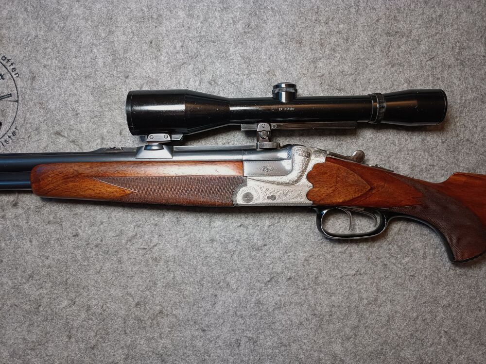 Escopeta de doble cañón Meuter Solingen similar al modelo Heym 55 con mira 6x42