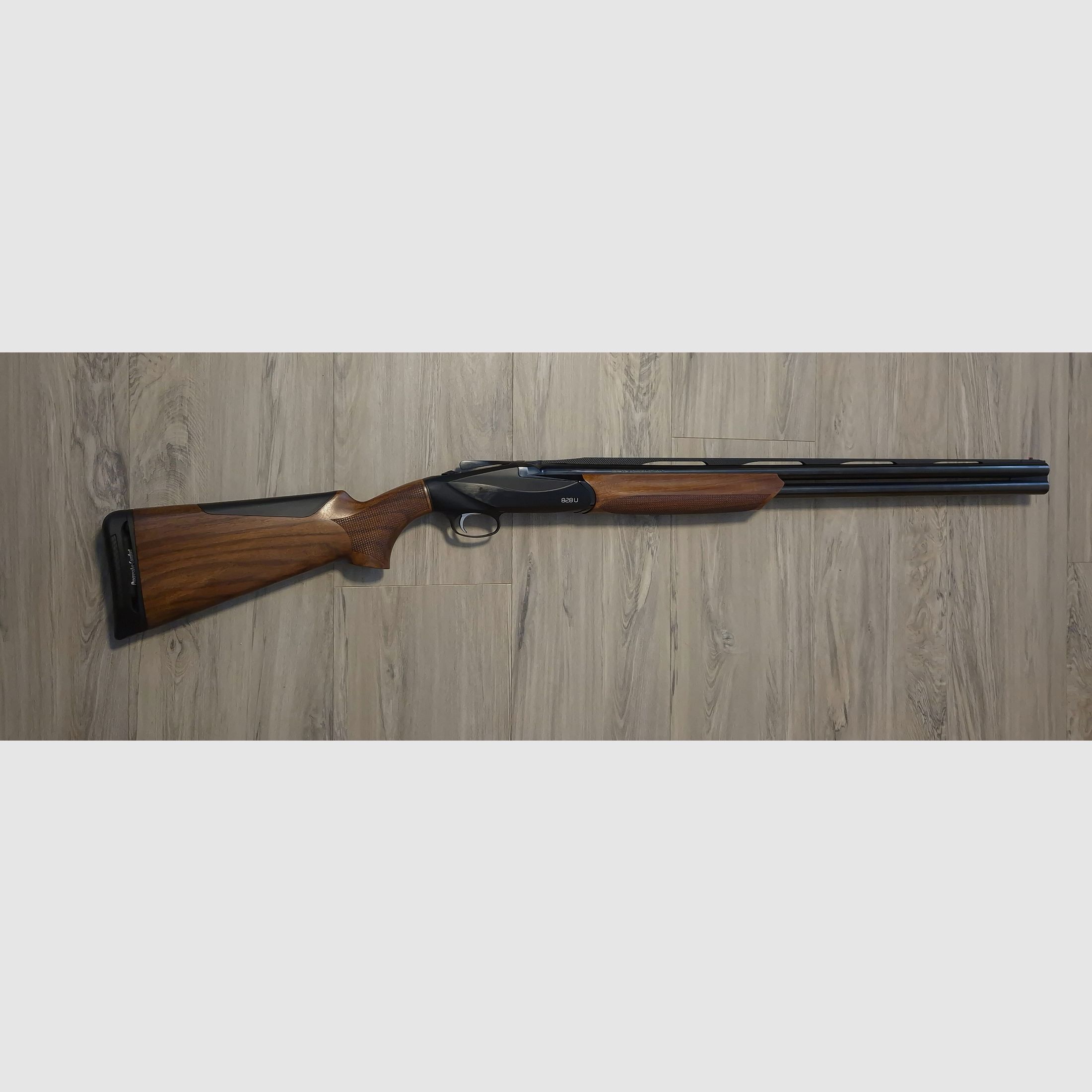 Benelli 828U Black over-and-under shotgun caliber 12/76