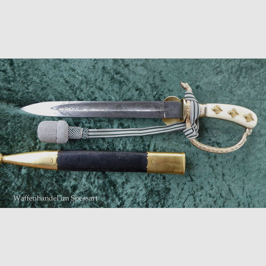 Stag knife with a guard vessel in ornate design from the time of World War II.