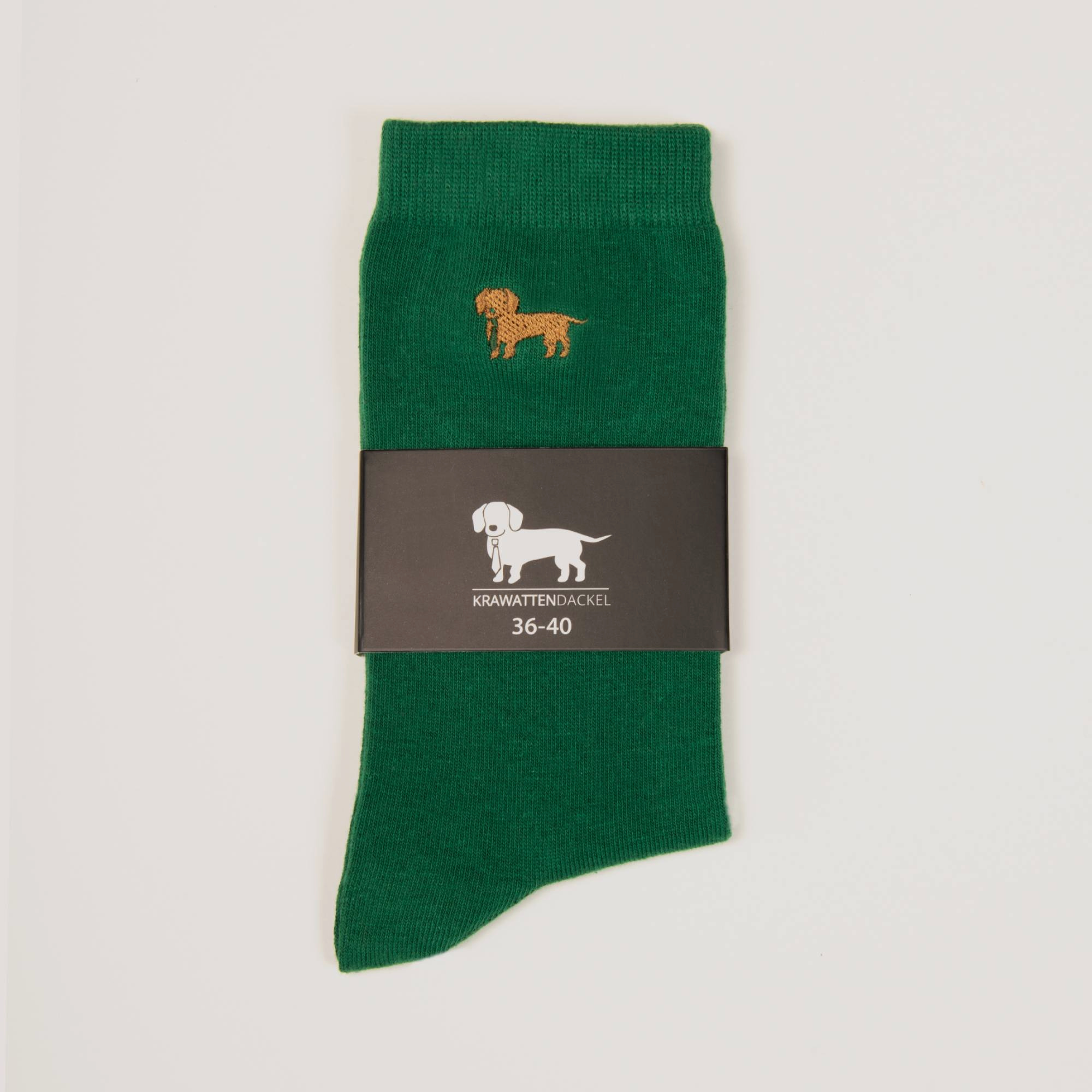 Grüne Socken mit gesticktem Dackelmotiv