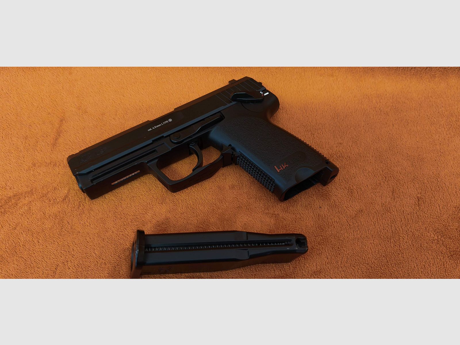 HK USP CO2 air pistol 4.5mm steel BB with signs of use
