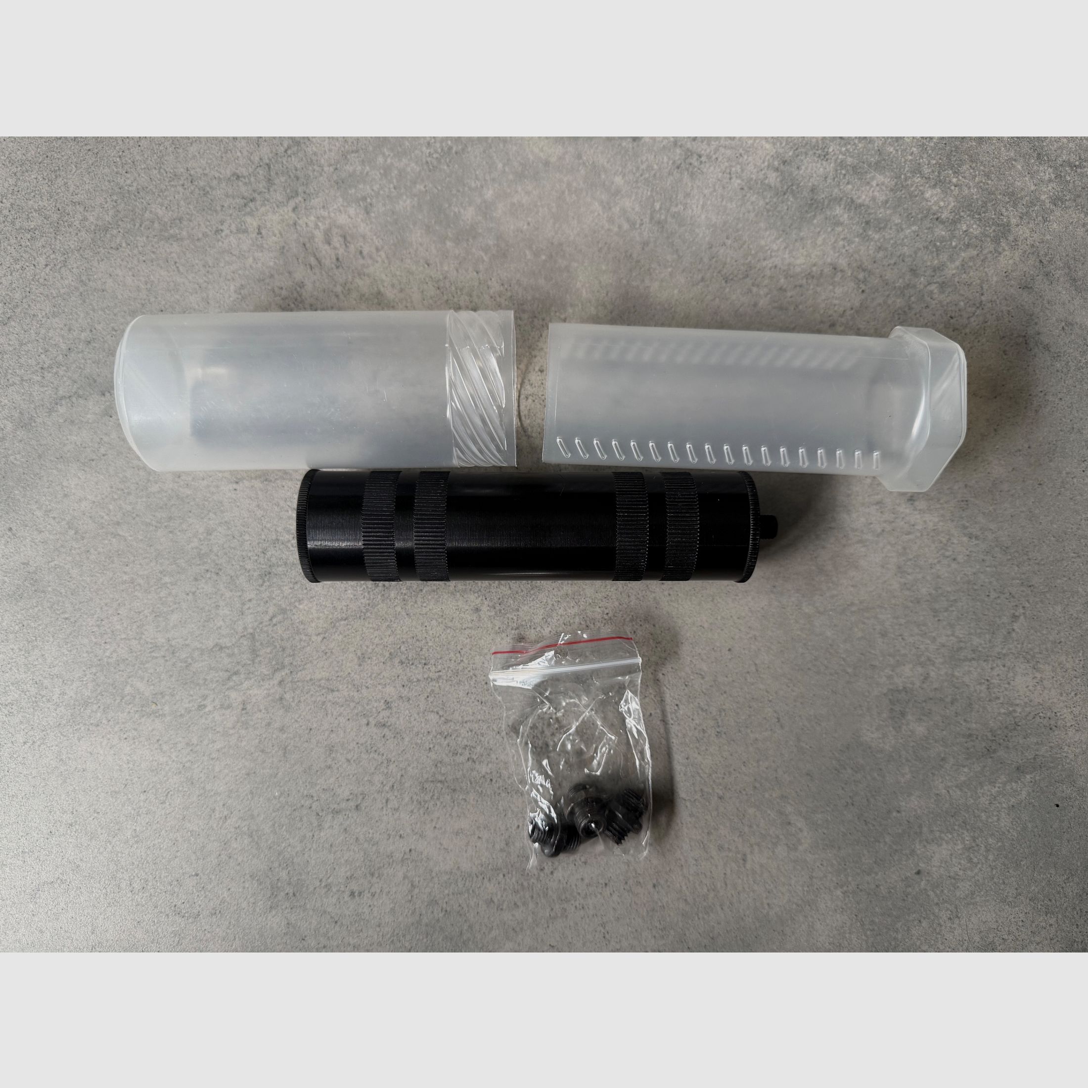 Suppressor for blank firing pistols, various adapters included