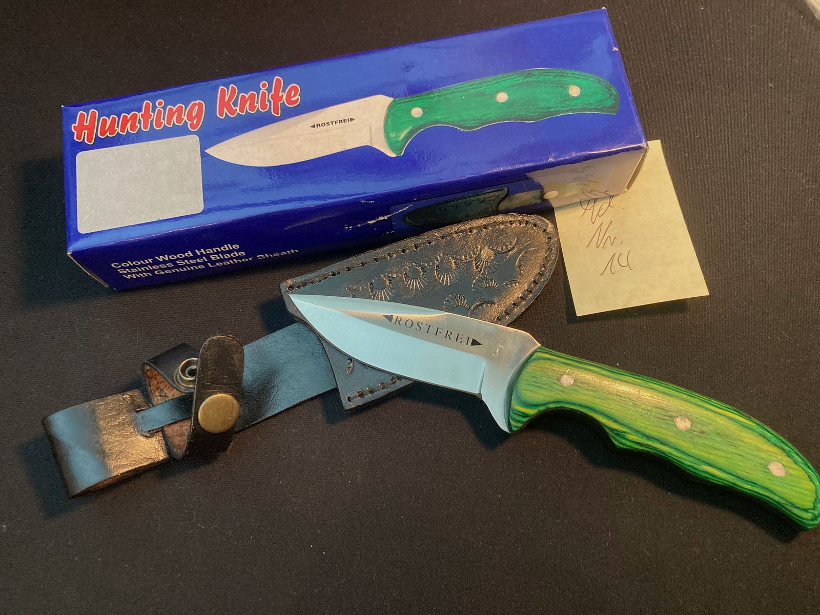 Jachtmes, riemmes, lemmet ca. 8cm, totaal 21cm, leren schede zwart, nieuw + OVP