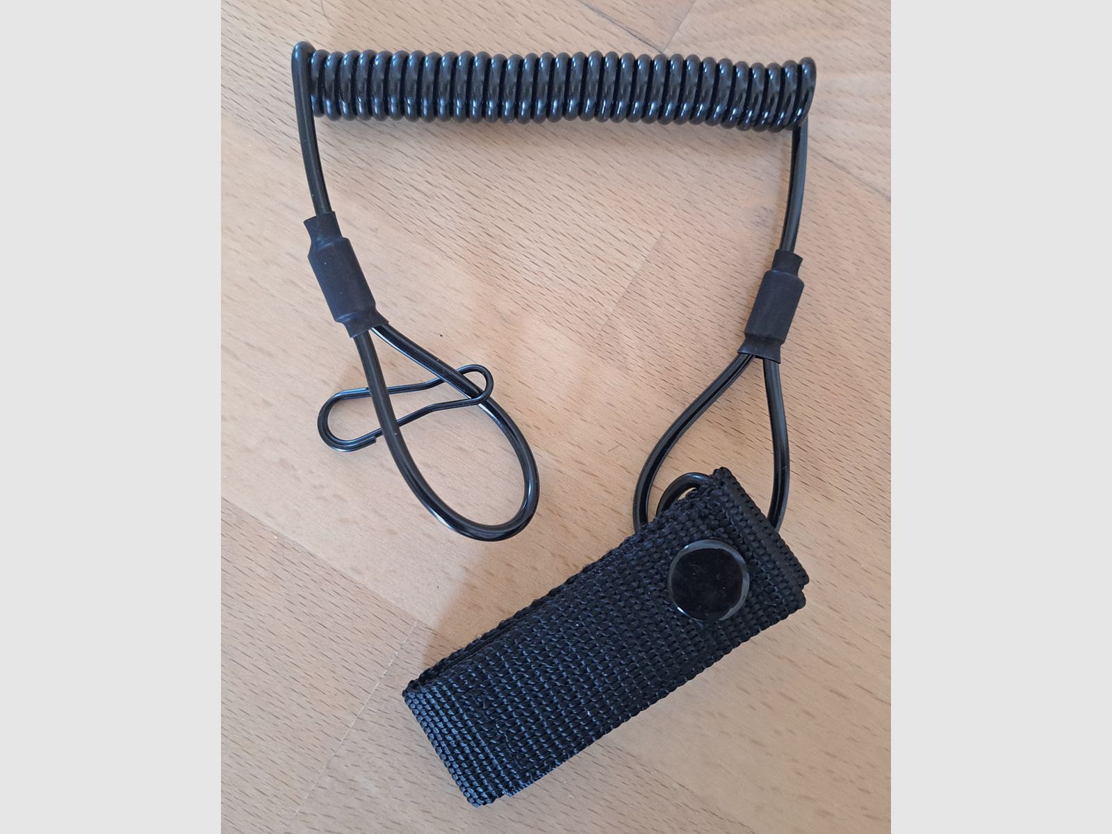 Cuerda de sujeción para armas cortas